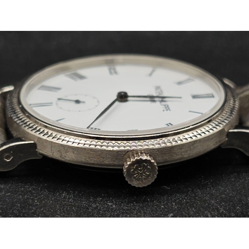 113 - An 18 K white gold Patek Philippe watch. 31 mmm case, white gold bezel, white face with Roman numera... 