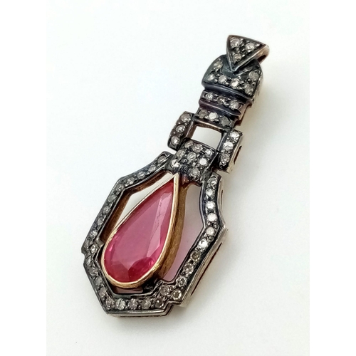 141 - An antique 18 K gold pendant with a pear shaped ruby (app 4 carats) and diamonds. Length: 33 mm, wei... 