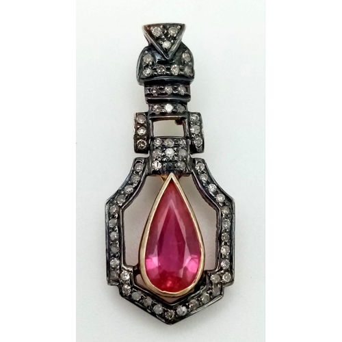 141 - An antique 18 K gold pendant with a pear shaped ruby (app 4 carats) and diamonds. Length: 33 mm, wei... 