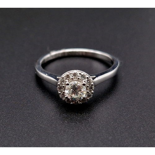 191 - An 18K White Gold Diamond Solitaire Ring. Purchased from Browns diamond store this ring has a centra... 