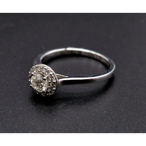 191 - An 18K White Gold Diamond Solitaire Ring. Purchased from Browns diamond store this ring has a centra... 