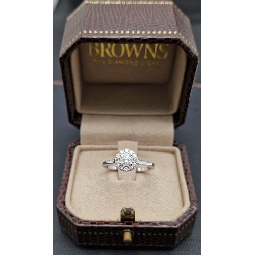 191 - An 18K White Gold Diamond Solitaire Ring. Purchased from Browns diamond store this ring has a centra... 