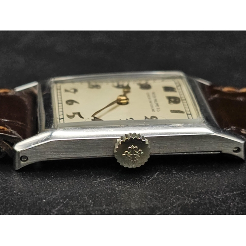 275 - A vintage Patek Philippe & Co watch. 27 x 23 mm white metal case, cream coloured face with roman num... 