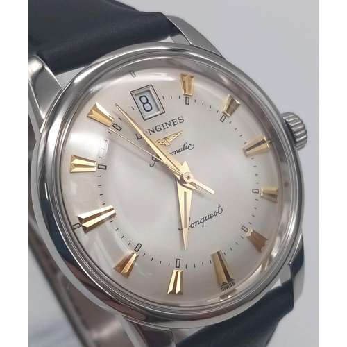 28 - A Longines Conquest watch. 35 mm case with white metal bezel, cream coloured face with yellow gold c... 