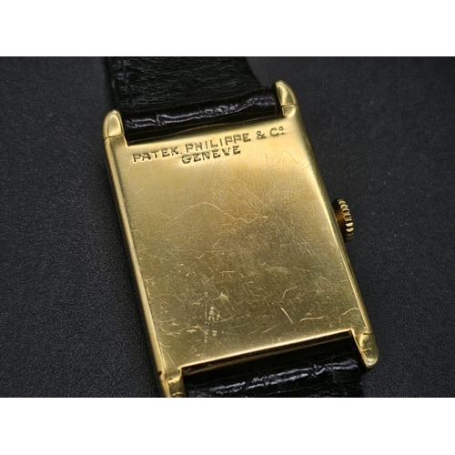 29 - A vintage 18 K yellow gold Patek Philippe watch. 30 x 25 mm  case with gold bezel, cream coloured fa... 