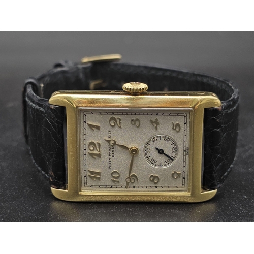 29 - A vintage 18 K yellow gold Patek Philippe watch. 30 x 25 mm  case with gold bezel, cream coloured fa... 