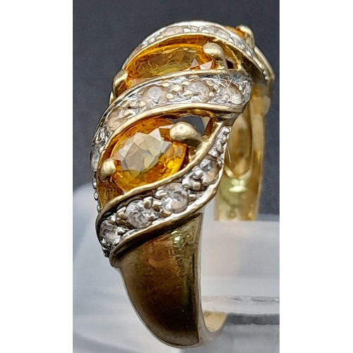 1285 - A Vintage 9K Yellow Gold Citrine and Diamond Ring. Three diagonal waves of bright citrine separated ... 