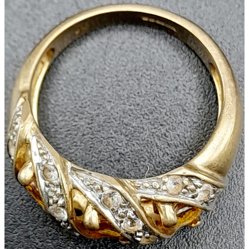 1285 - A Vintage 9K Yellow Gold Citrine and Diamond Ring. Three diagonal waves of bright citrine separated ... 