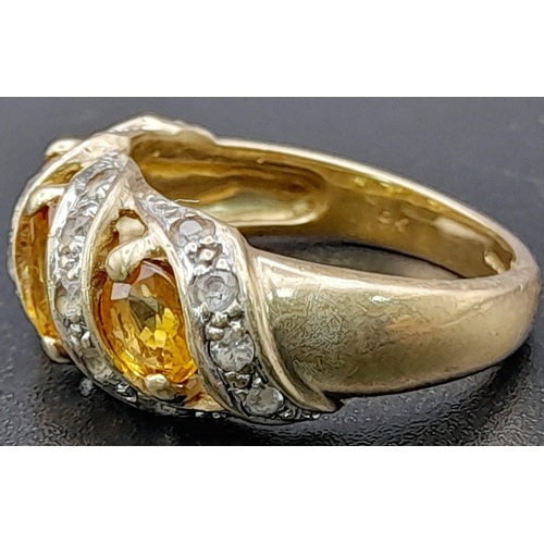 1285 - A Vintage 9K Yellow Gold Citrine and Diamond Ring. Three diagonal waves of bright citrine separated ... 