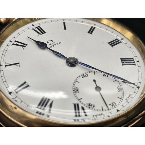 36 - A yellow gold plated OMEGA pocket watch. 50 mm case, white dial with black roman numerals, Inscripti... 