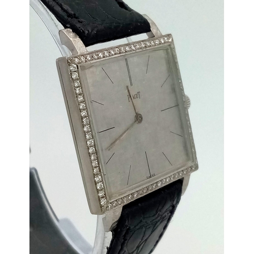 382 - A white gold PIAGET watch. 25 mm square case with gold bezel covered with diamonds. Machine engraved... 