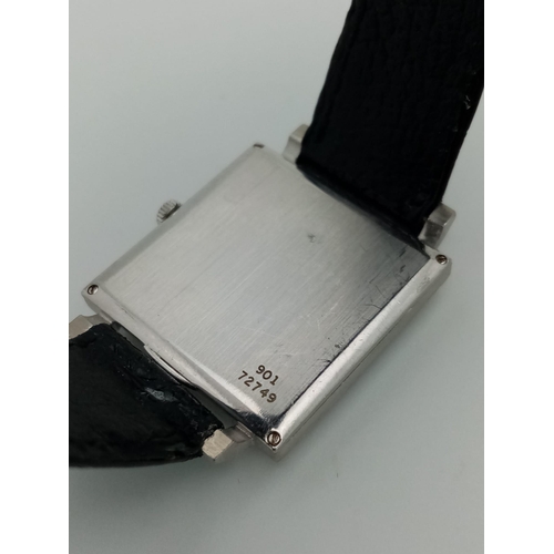 382 - A white gold PIAGET watch. 25 mm square case with gold bezel covered with diamonds. Machine engraved... 