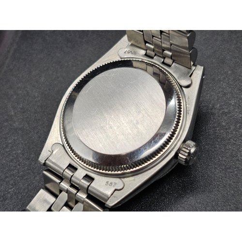 43 - A stainless steel ROLEX Oyster Perpetual Datejust. 31mm case, bezel with diamonds, face: mother of p... 