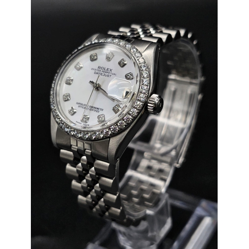 43 - A stainless steel ROLEX Oyster Perpetual Datejust. 31mm case, bezel with diamonds, face: mother of p... 