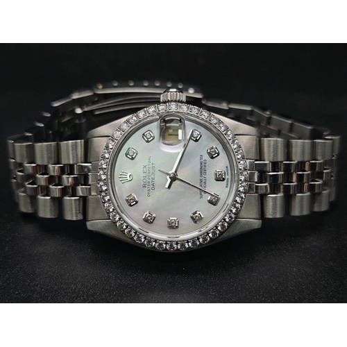 43 - A stainless steel ROLEX Oyster Perpetual Datejust. 31mm case, bezel with diamonds, face: mother of p... 