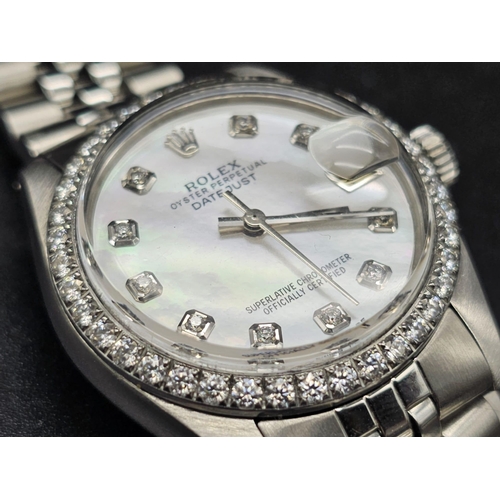 43 - A stainless steel ROLEX Oyster Perpetual Datejust. 31mm case, bezel with diamonds, face: mother of p... 