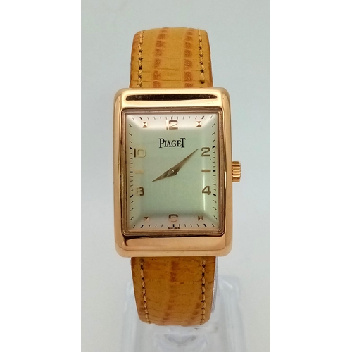 463 - An 18 K rose gold PIAGET watch. 34 x 24 mm case, cream dial with rose gold roman numerals and hands.... 