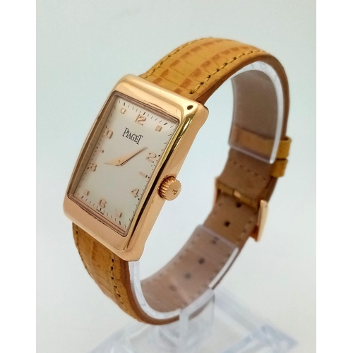 463 - An 18 K rose gold PIAGET watch. 34 x 24 mm case, cream dial with rose gold roman numerals and hands.... 