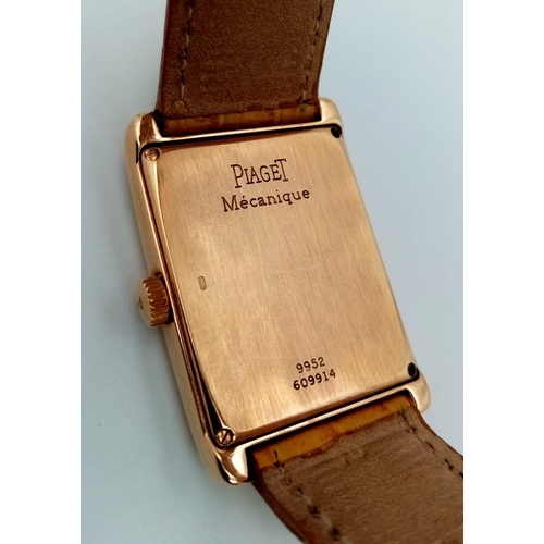 463 - An 18 K rose gold PIAGET watch. 34 x 24 mm case, cream dial with rose gold roman numerals and hands.... 