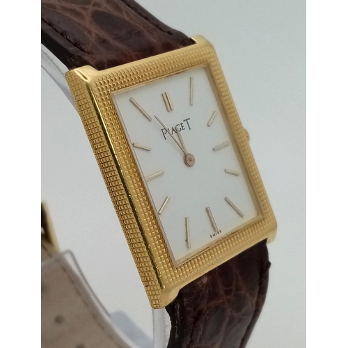 470 - An 18 k yellow gold PIAGET watch. 26 x 24 mm case, white dial with god hour marks and hands. Origina... 