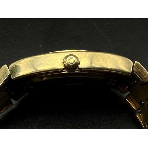 605 - An 18 K yellow gold OMEGA constellation watch. 39 x 36 mm case with gold bezel, face, hour marks and... 