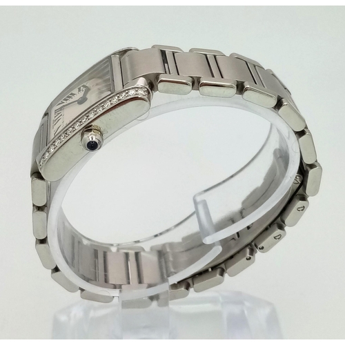 612 - A stainless steel CARTIER watch. 23 x 20 mm case, Bezel with diamonds on two sides, white face with ... 