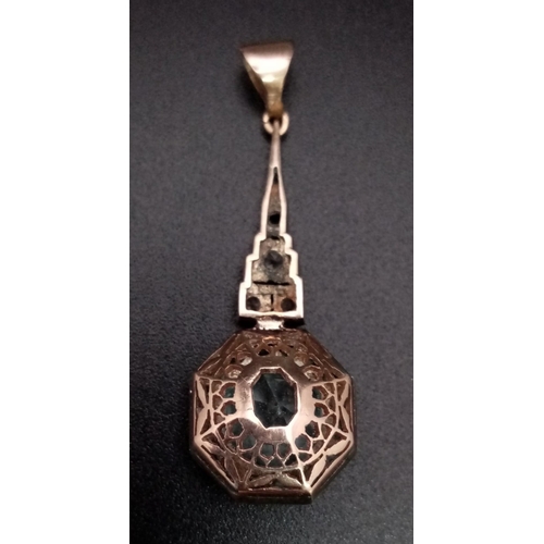 633 - An Art DECO 9 K rose and white gold pendant with an aquamarine and diamonds (one missing). height: 4... 