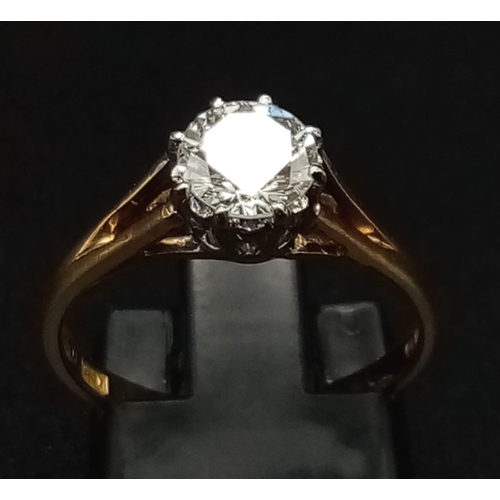 124 - An 18K Yellow Gold Diamond (0.9ct) Solitaire Ring. SI/- F/G round brilliant cut. Size L 1/2. 2.73g t... 