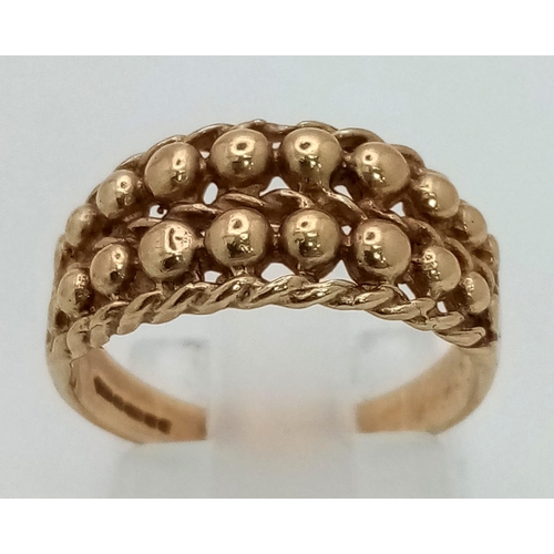 1297 - A Vintage 9K Yellow Gold Double-Row Keeper Ring. Size M.
3.03g