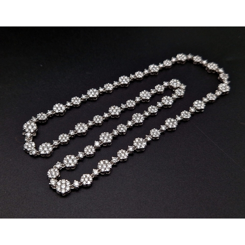 27 - An Elegant 18K White Gold Diamond Necklace. Over 11.5ct of quality diamonds create the perfect piece... 