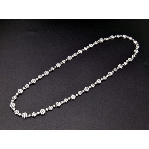 27 - An Elegant 18K White Gold Diamond Necklace. Over 11.5ct of quality diamonds create the perfect piece... 