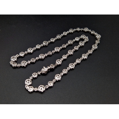 27 - An Elegant 18K White Gold Diamond Necklace. Over 11.5ct of quality diamonds create the perfect piece... 