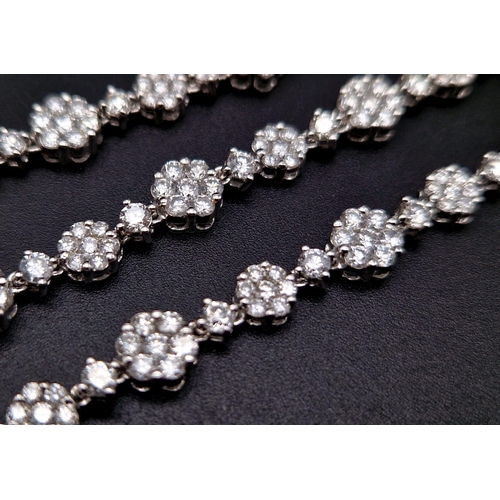 27 - An Elegant 18K White Gold Diamond Necklace. Over 11.5ct of quality diamonds create the perfect piece... 