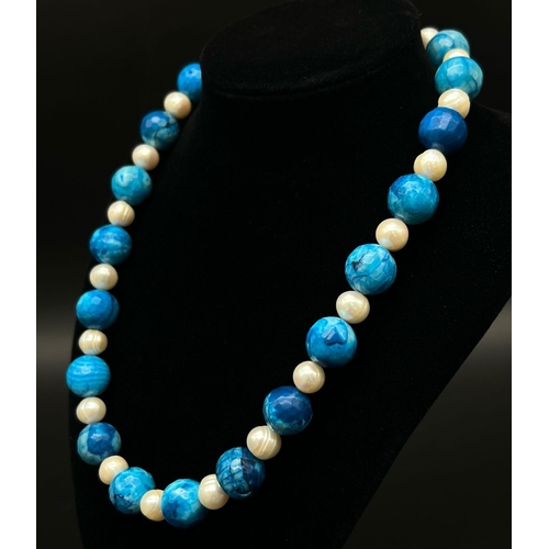 315 - A Dragons Breath Blue Agate and Cultured Pearl Necklace. Agate - 12mm beads. 44cm