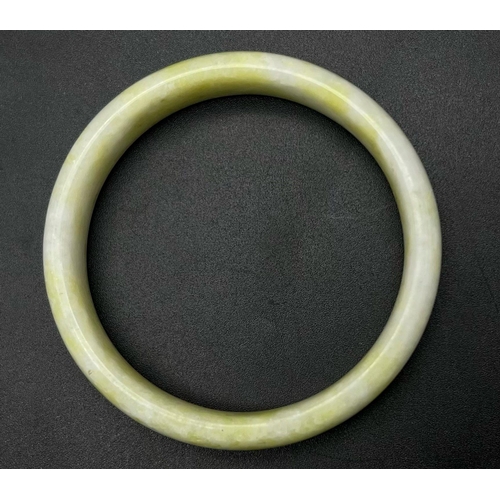 512 - A Quality Cauliflower Jade Bangle. 6cm inner diameter.