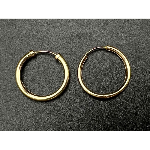 1427 - A Pair of 9K Yellow Gold Small Hoop Earrings. 0.44g