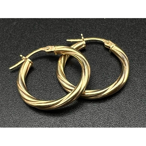 1777 - A Pair of 9K Yellow Gold Hoop Earrings. Twist design. 0.81g