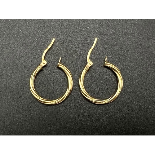 1777 - A Pair of 9K Yellow Gold Hoop Earrings. Twist design. 0.81g