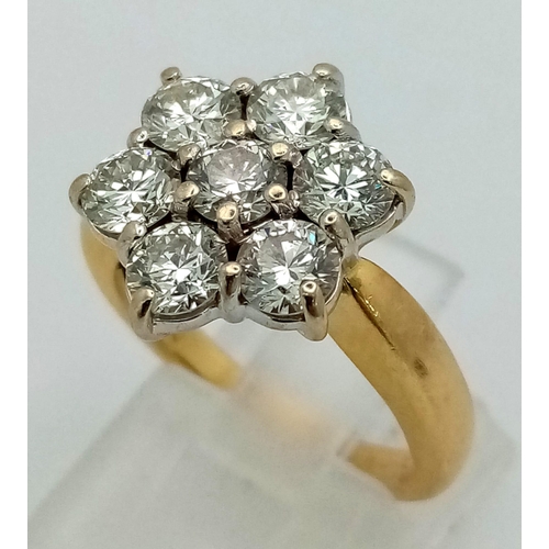 604 - An 18K Yellow Gold Diamond Ring. Seven quality white round-cut diamonds (2ct approx) create the perf... 