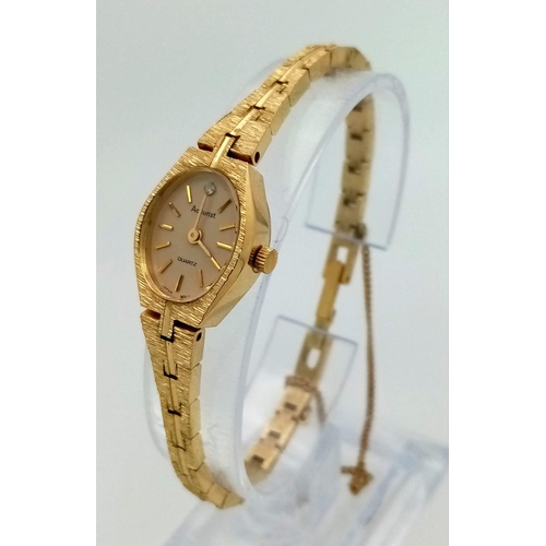 778 - A Vintage Gold Plated Accurist Ladies Watch. Gold plated strap and case - 16mm. White stone at 12. Q... 