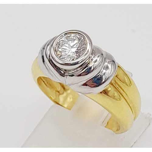 296 - A High-Karat Yellow and White Gold (tested) Diamond Solitaire Ring. 0.75ct. VS2. 8.65g total weight.... 