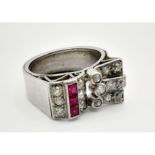 373 - A 950 Platinum Diamond and Ruby Ring. Art deco in style, this round-cut diamond and square-cut ruby ... 