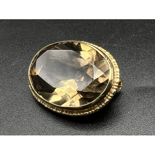 476 - A Vintage 9K Yellow Gold Smoky Quartz Brooch. Beautifully faceted 25ct stone. 9.2g total weight. Ref... 