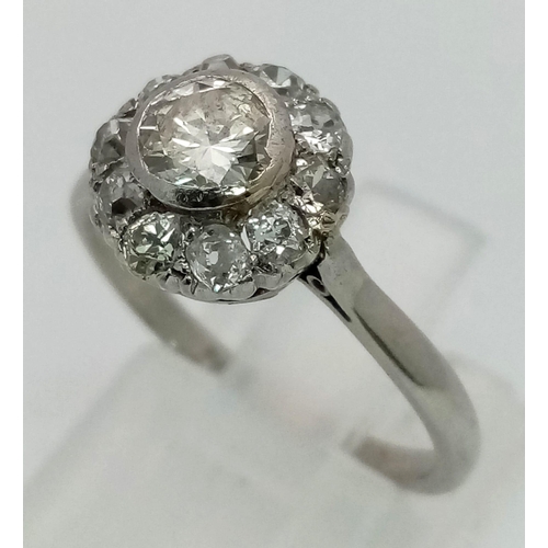 492 - A Platinum (950) Diamond Ring. A central 0.7ct diamond with a diamond halo surround. Size N. 3.81g t... 