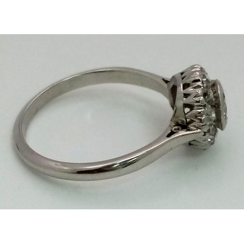 492 - A Platinum (950) Diamond Ring. A central 0.7ct diamond with a diamond halo surround. Size N. 3.81g t... 