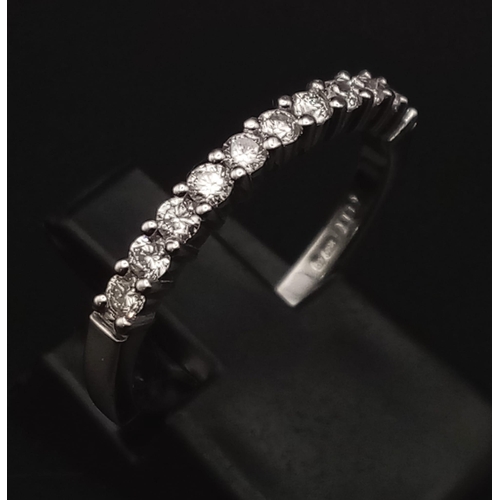 640 - An 18K White Gold Half Eternity Diamond Ring. 0.33ct. Size N. 2.89g total weight. Ref: 007576