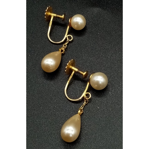 764 - A Pair of 9K Gold and Pearl Drop Earrings. Classic screw-back clasp. 2cm drop. 2.4g total weight.