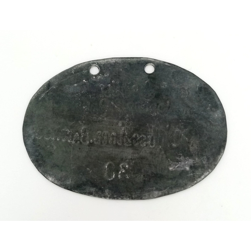 432 - WW1 Imperial German Dog Tag to a Corporal in the Foot Artillery Battalion.