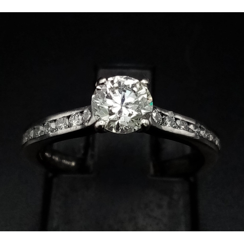 145 - A Hearts on Fire Platinum and Diamond Ring. 0.52ct brilliant round-cut diamond with additional diamo... 