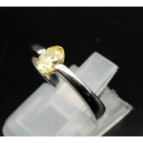 219 - An Platinum and Fancy Yellow Diamond (0.45ct) Ring. VS1 clarity. Size K. 4.06g total weight. Comes w... 